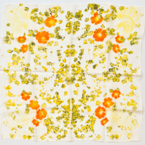 square silk scarf flat with symmetrical pattern in 4 quadrants of orange sufler cosmos image and black-flecked yellow marigold petals eco-printed onto white background