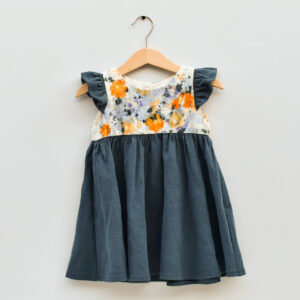 2T toddler dress, sleevless with ruffles, high waist, gathered skirt. bodice is naturally dyed on raw silk with flowers showing images of sulfur cosmos, scapiosa petals, and purple rose of sharon. skirt and ruffles are an aquamarine raw silk