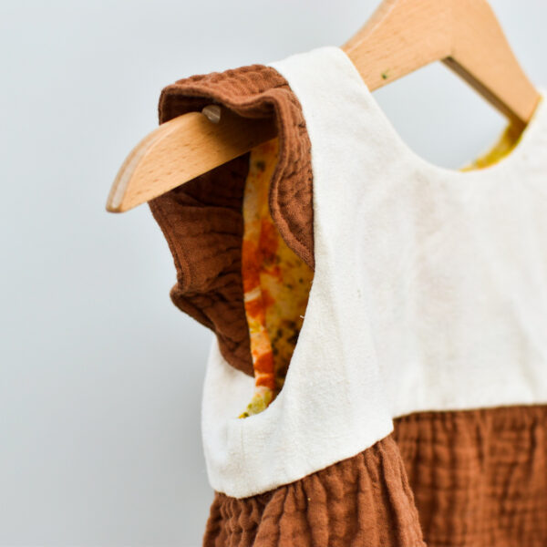 Detail of inside-out girl's dress to show hand-stiched bodice lining and french seams on skirt