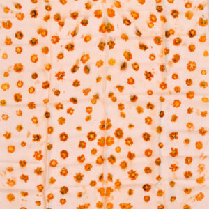 square scarf spread out showing even pattern of orange coreopsis flowers eco-printed onto fabric