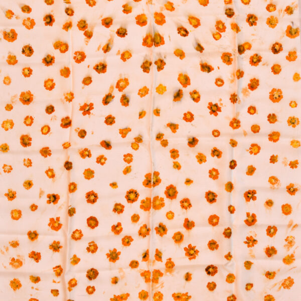 square scarf spread out showing even pattern of orange coreopsis flowers eco-printed onto fabric